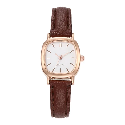 Belt—brown belt with rose gold shell strips
