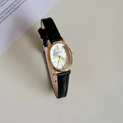 Black with gold frame and white surface