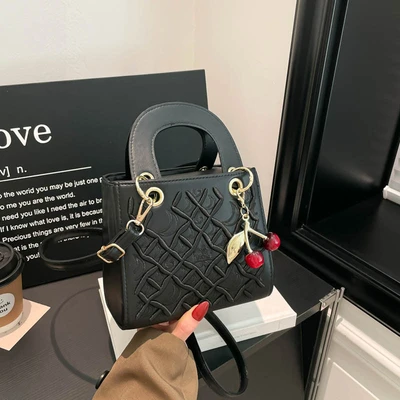 Black strap with charm