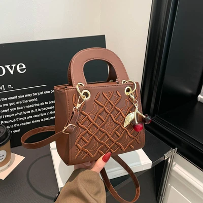 Brown strap charm