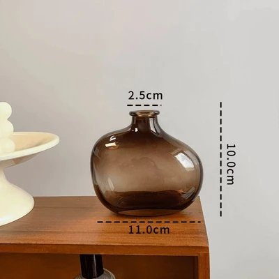 Slanted shoulder ash glass bottle