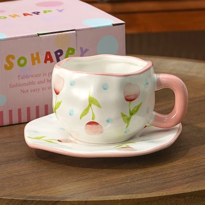 Xd-1060-010i cup and saucer (light pink flower and blue dot)