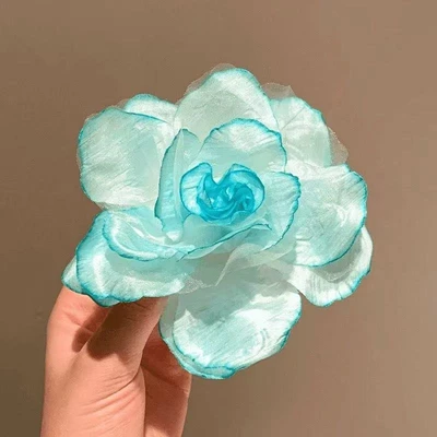 Large rose in green mesh
