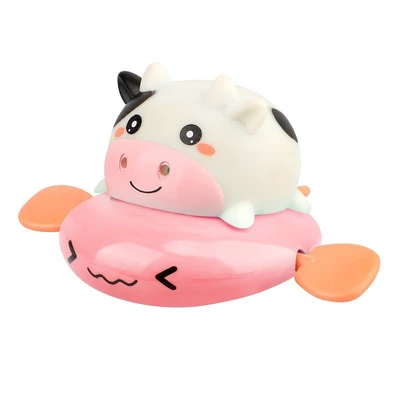 Cute pink cow playing in water