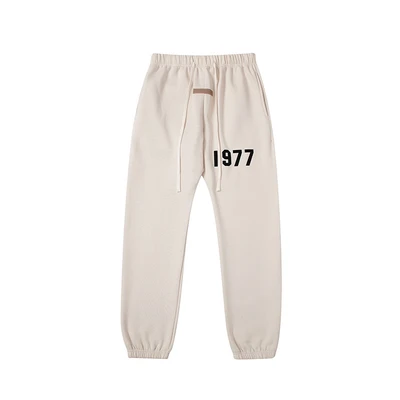 2211 Apricot-colored pants with flocked lettering