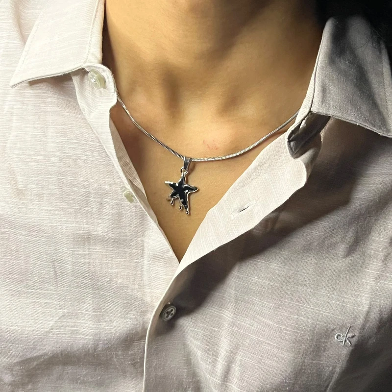 Black and silver star pendent
